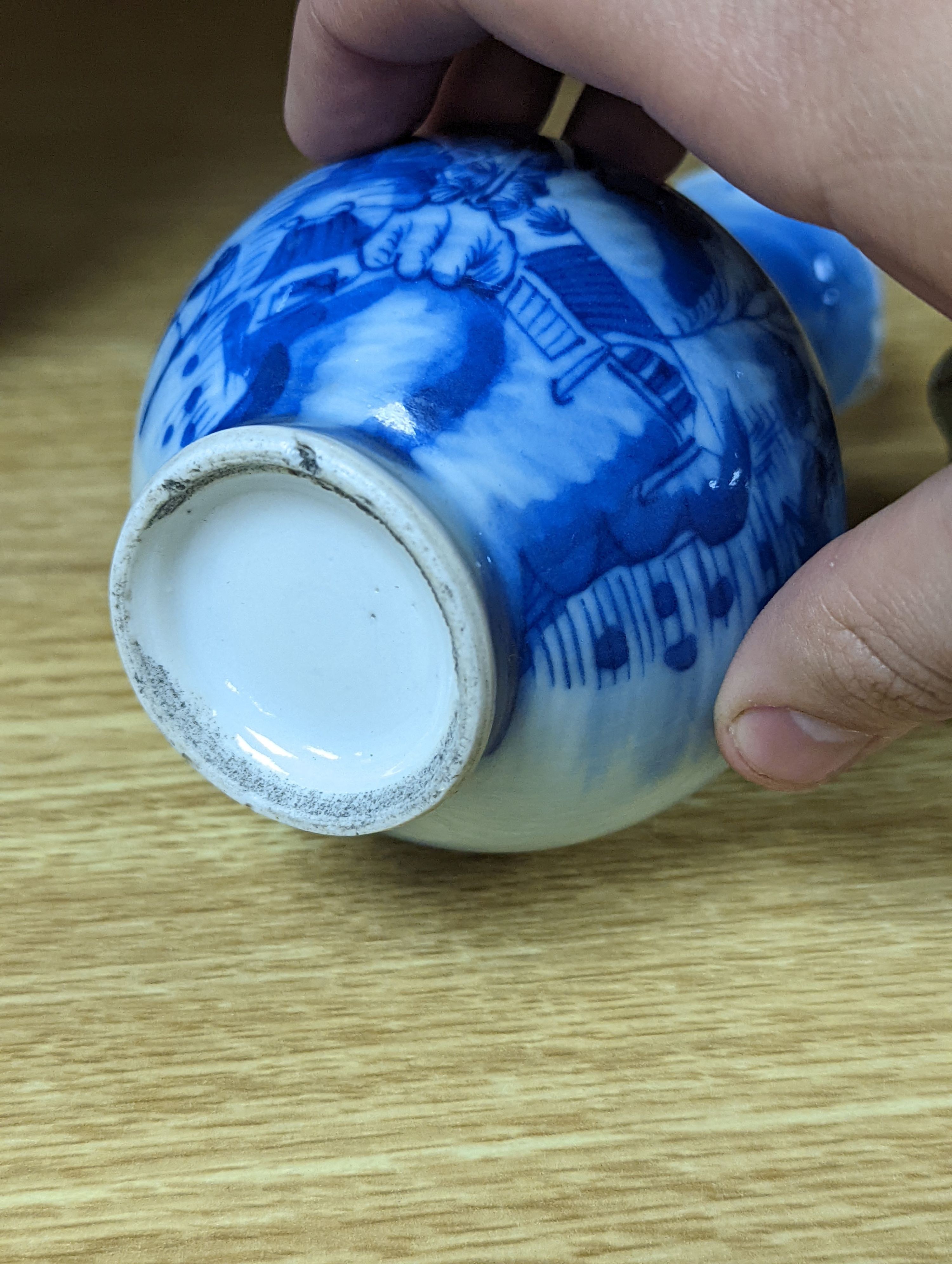 A 19th century Chinese famille rose rice bowl, cover and stand, together with a blue and white dragon jar and similar bottle vase. Largest 18cm